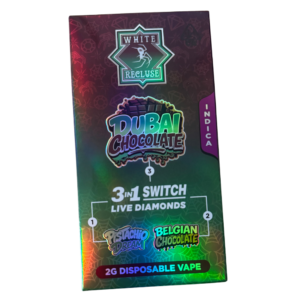 White Recluse Switch 2g – Dubai Chocolate Disposable Pen – Live Diamonds (Indica) Packaging for a Dubai Chocolate 3‑in‑1 Switch Live Diamonds 2G disposable vape; flavors Pistachio Dream and Belgian Chocolate.